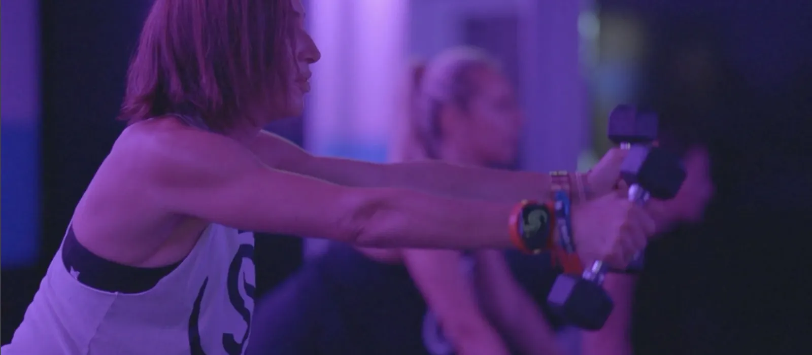 A Studio Spin member performing controlled Pilates-inspired movement.